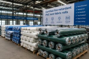 Certified fire-retardant PVC tent fabric rolls stacked in a factory warehouse