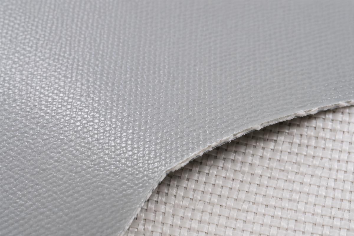 Close-up of knife-coated PVC fabric texture, showing uniform coating layer on woven base