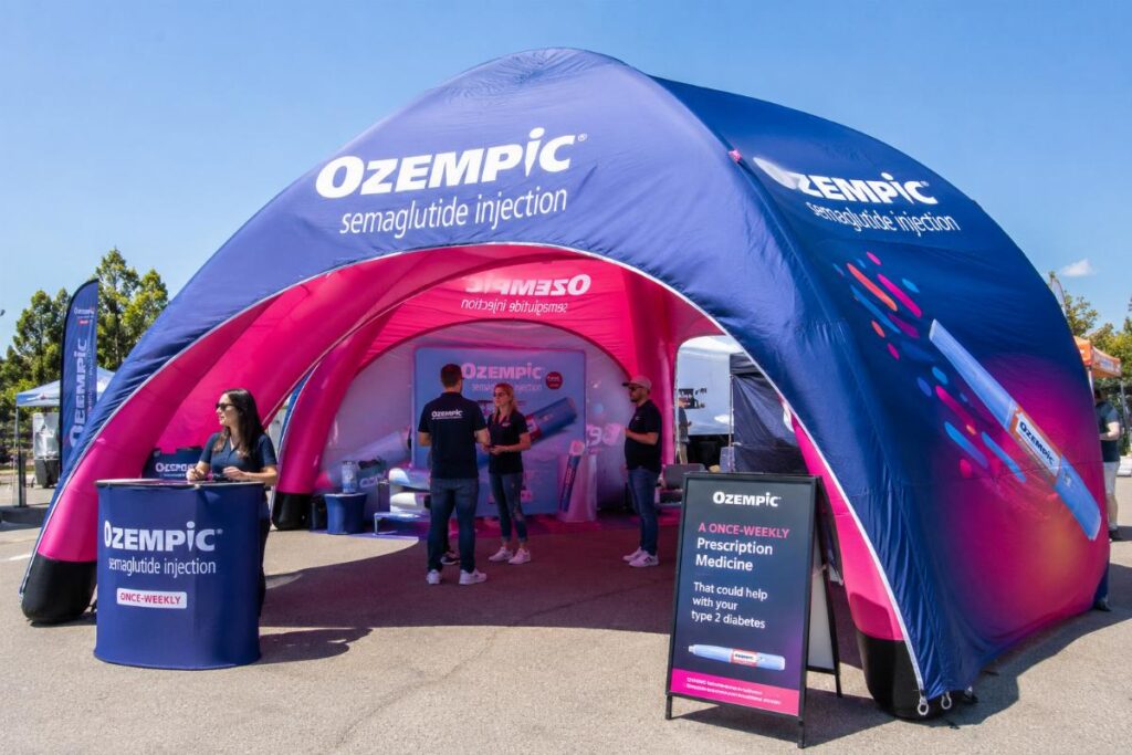 Custom printed inflatable PVC tent set up at outdoor consumer roadshow event