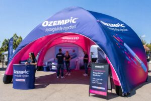 Custom printed inflatable PVC tent set up at outdoor consumer roadshow event