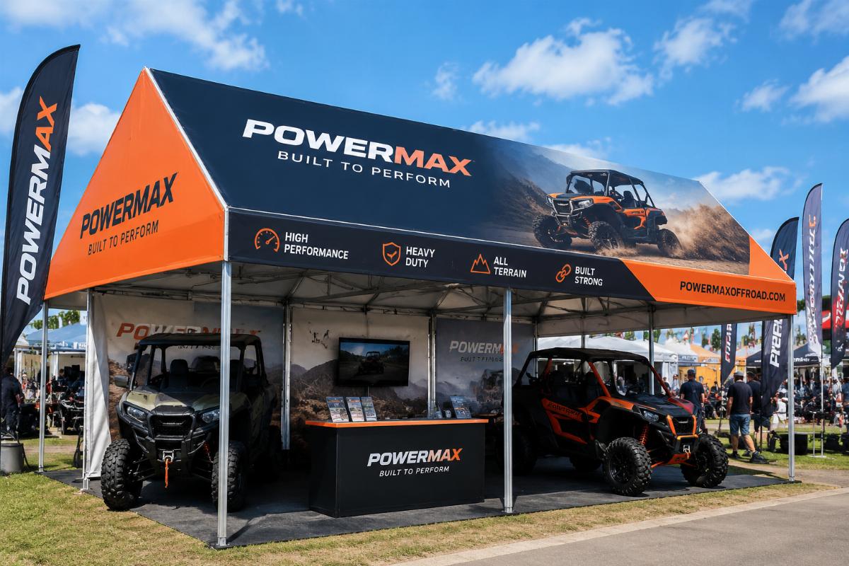 Custom printed PVC canopy tarpaulin installed at an outdoor trade show booth