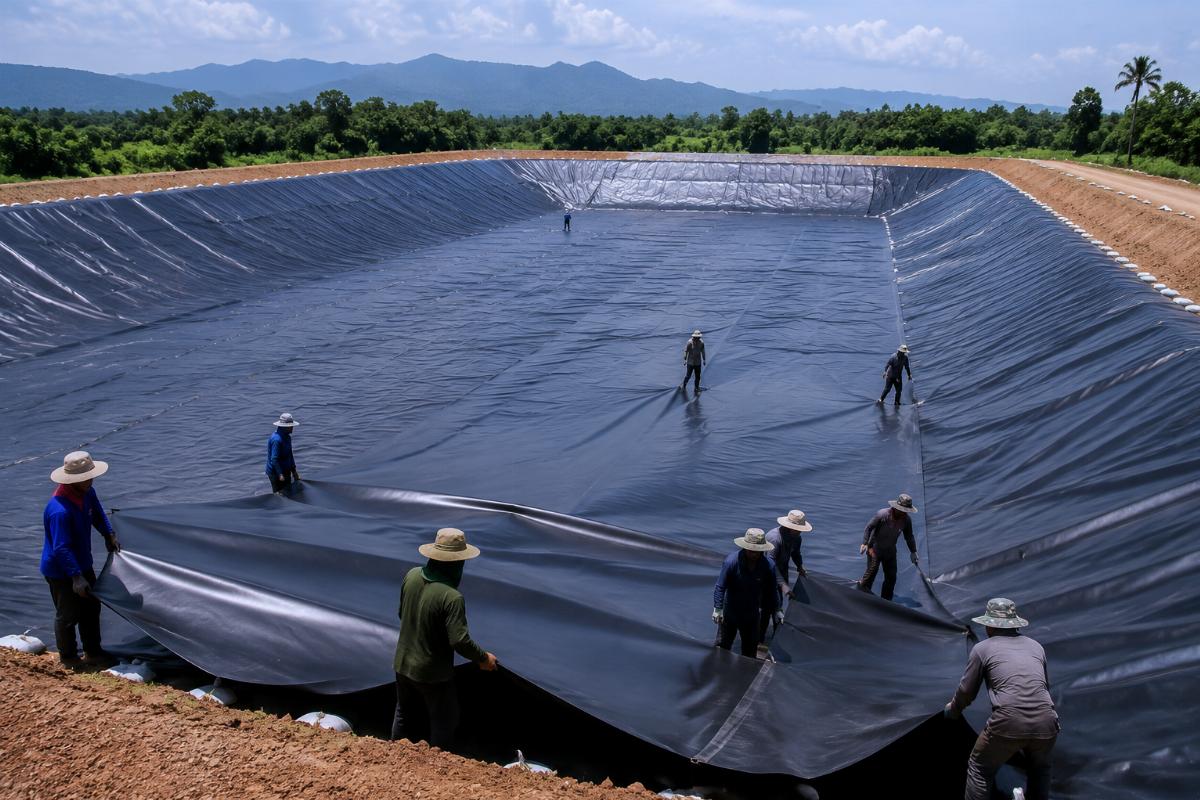 On-site installation of PVC membrane for a 1200-acre agricultural irrigation reservoir in Southeast Asia